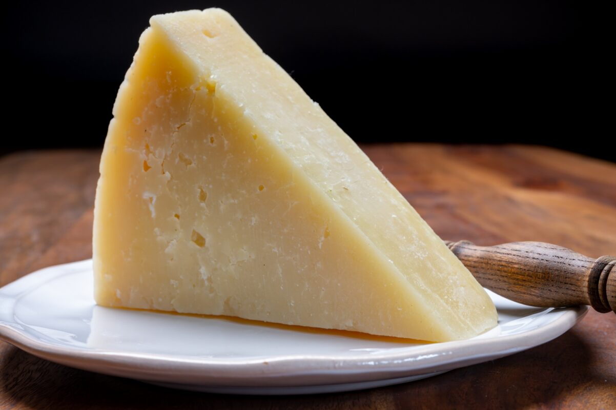 A large wedge of pecorino romano cheese